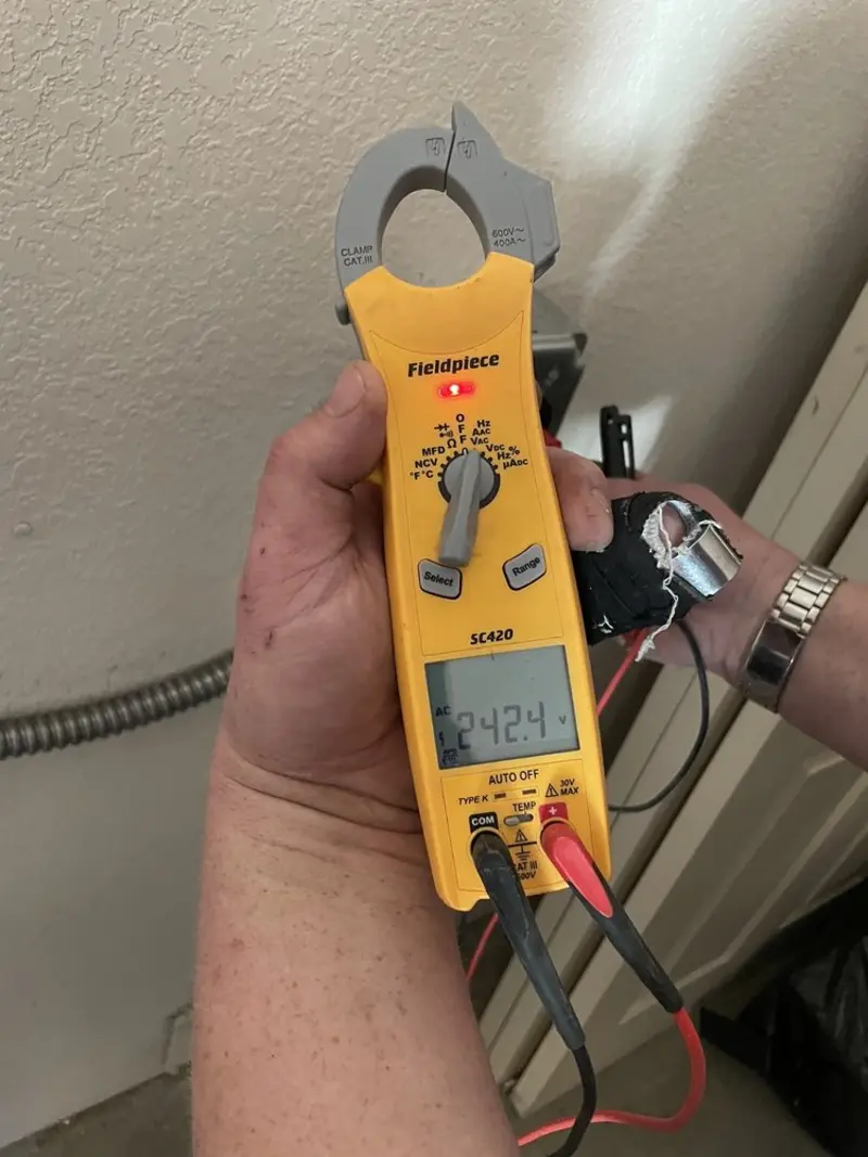Voltage testing with clamp meter during Electrical Installation Services in Cedar Rapids